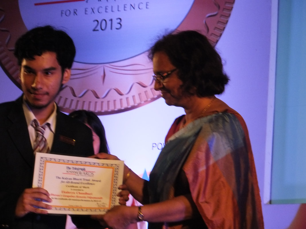 Ekalavya Chaudhuri receiving an award.